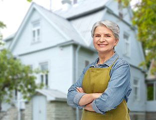 Image showing portrait of smiling senior woman in garden apron