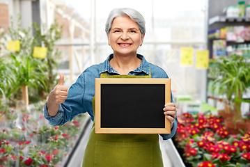 Image showing senior gardener with chalkboard showing thumbs up