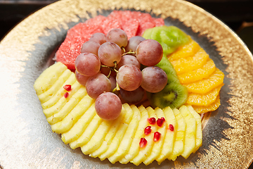 Image showing Plate with mixed fruits. Shallow dof.