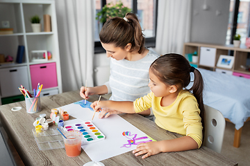 Image showing mother with little daughter drawing at home