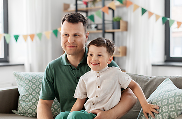 Image showing happy father and little son at home birthday party