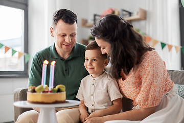 Image showing happy family with birthday cake at home