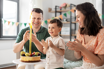 Image showing happy family with birthday cake at home