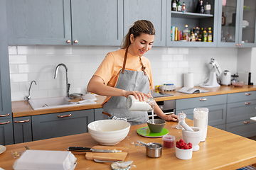 Image showing woman cooking food and baking on kitchen at home