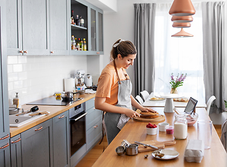 Image showing woman cooking food and baking on kitchen at home