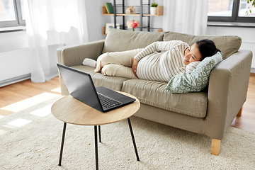 Image showing happy pregnant asian woman with laptop at home