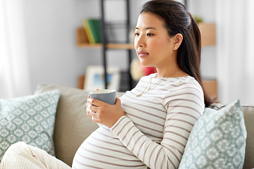 Image showing pregnant woman drinking tea at home