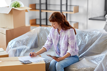 Image showing asian woman moving to new home and counting money