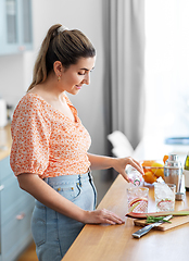 Image showing woman making cocktail drinks at home kitchen