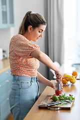 Image showing woman making cocktail drinks at home kitchen