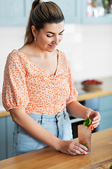 Image showing woman making cocktail drinks at home kitchen