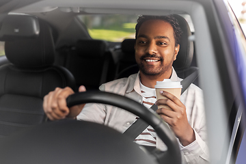 Image showing happy indian man or driver with coffee driving car