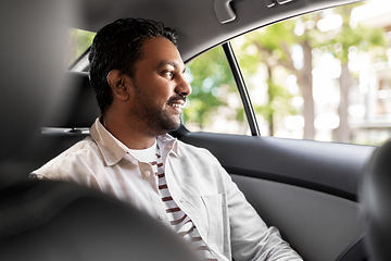 Image showing smiling indian male passenger in taxi car