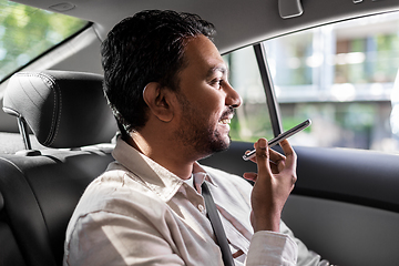 Image showing male passenger calling on smartphone in taxi car