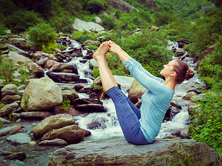 Image showing Woman doing Ashtanga Vinyasa Yoga asana outdoors