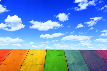 Image showing multicolored bright stand from wooden boards and sky