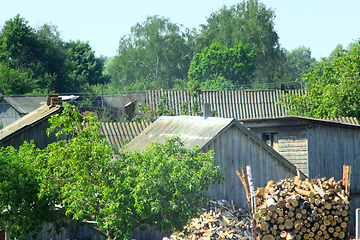 Image showing Rural manor with house firewood and shed