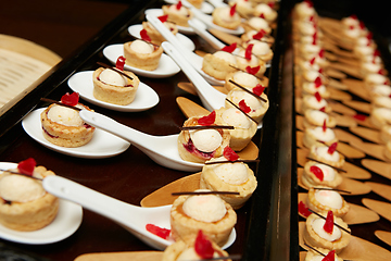 Image showing Canapes with dessert on the banquet table.