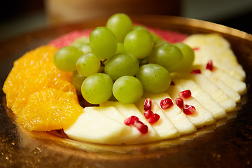 Image showing Plate with mixed fruits. Shallow dof.