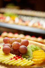 Image showing Plate with mixed fruits. Shallow dof.