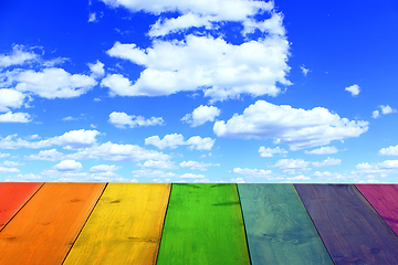 Image showing multicolored stand from wooden boards and blue sky