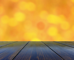 Image showing table from wooden boards with blurred background