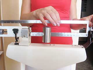 Image showing woman is weighed on the scales