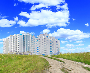 Image showing multistory modern house in field with country road