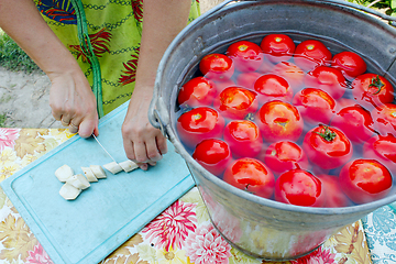 Image showing tomatoes in the water prepared for preservation