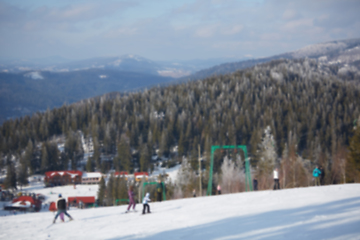 Image showing Blur panoramic view of sport resort for winter vacation. Skies with back light. Warm filter with original sun color tones