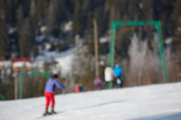 Image showing Blur panoramic view of sport resort for winter vacation. Skies with back light. Warm filter with original sun color tones