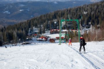 Image showing Blur panoramic view of sport resort for winter vacation. Skies with back light. Warm filter with original sun color tones