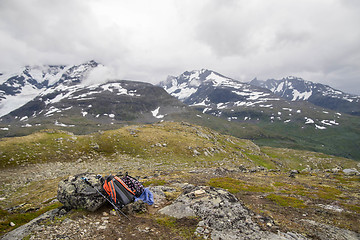 Image showing Backpacker\'s bag on top of mountain