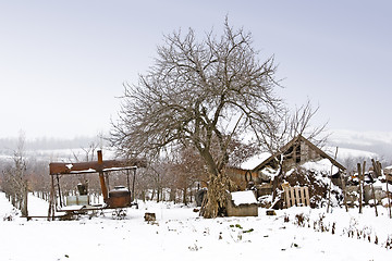 Image showing traditional alcohol still in farmyard