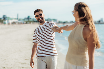 Image showing happy couple on summer beach