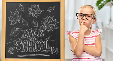 Image showing little student girl in glasses thinking