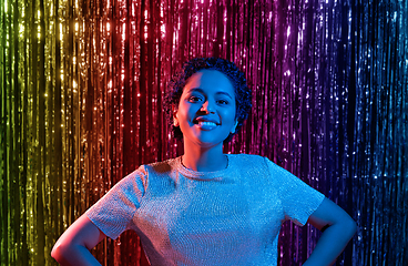 Image showing african woman at party over rainbow curtain