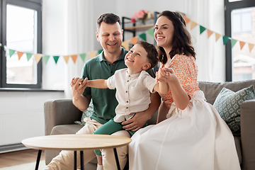 Image showing happy family with little son at birthday party