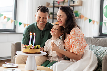 Image showing happy family with birthday cake at home