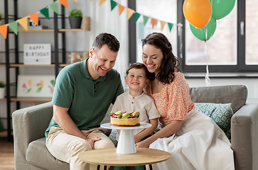Image showing happy family with birthday cake at home