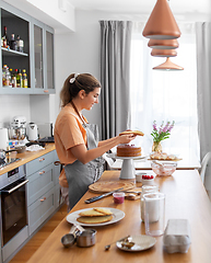 Image showing woman cooking food and baking on kitchen at home