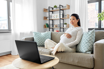 Image showing pregnant asian woman with laptop at home