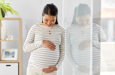 Image showing happy pregnant asian woman at home