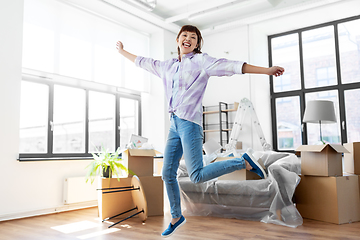 Image showing happy asian woman with stuff moving to new home