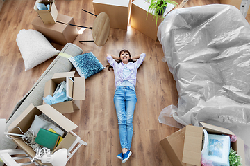 Image showing happy woman with boxes moving to new home