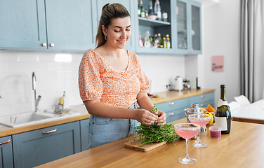 Image showing woman making cocktail drinks at home kitchen