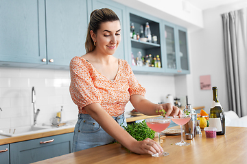 Image showing woman making cocktail drinks at home kitchen