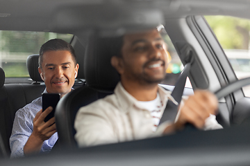 Image showing male passenger with smartphone in taxi car