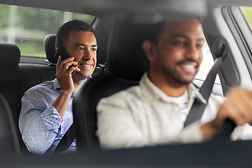 Image showing male passenger calling on smartphone in taxi car