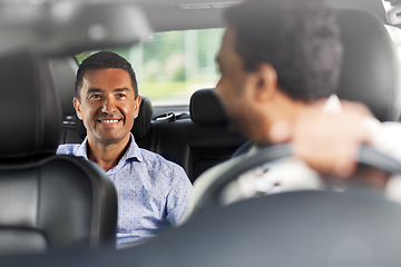 Image showing middle aged male passenger talking to car driver